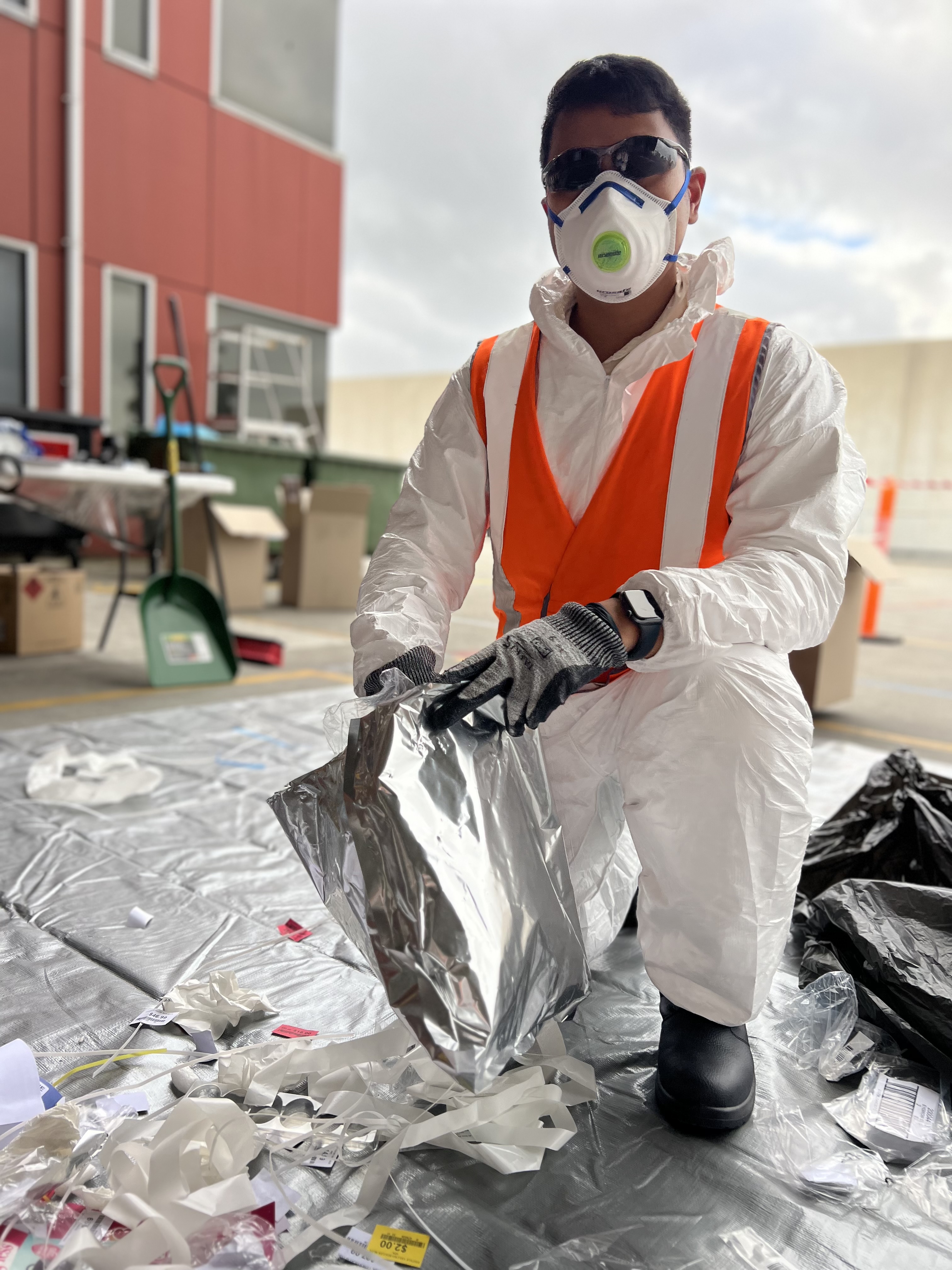 A team member participating in a waste audit