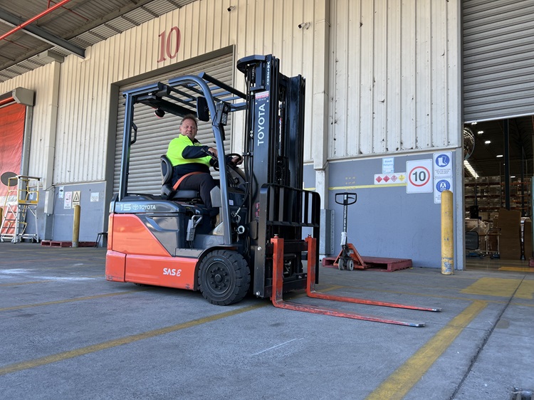 Team member on a forklift