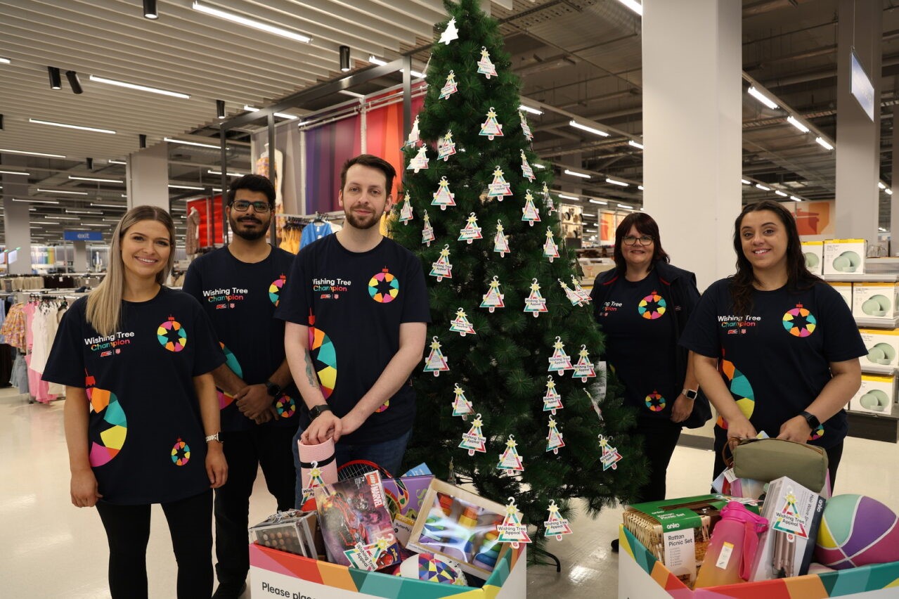 Team members with Wishing Tree gifts